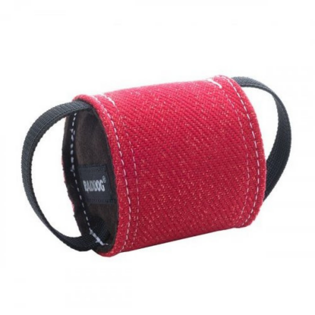 A red Raddog Bite Roll Nylcot toy with two handles designed to fit inside a dumbell for dog training.
